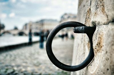 Close-up of metal loops ring fixed on wall