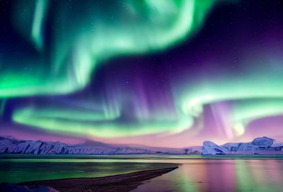 Low angle view of sea against sky at night