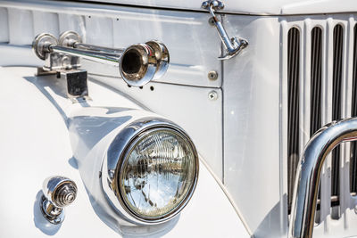 Close-up of white vintage car headlight