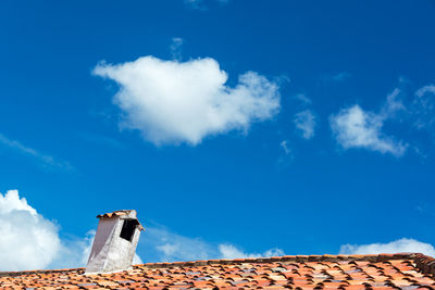 Low angle view of roof against sky