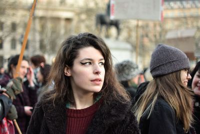 Close-up portrait of young woman in winter
