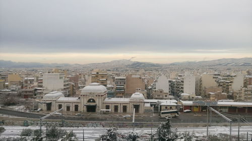 Cityscape against sky during winter