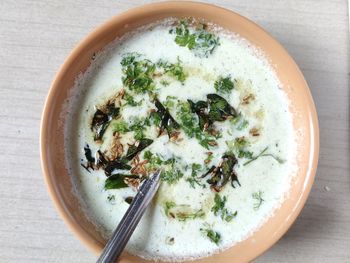 A top view photograph of coconut chutney to eat with idali sambhar.