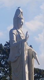 Low angle view of statue against sky