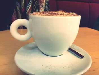 Close-up of coffee cup on table