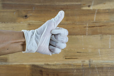 Midsection of man working in wood