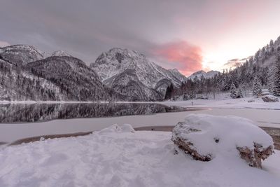 Scenic view of frozen lake against sky during winter
