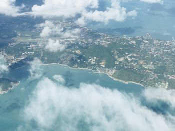 Aerial view of clouds over landscape against sky