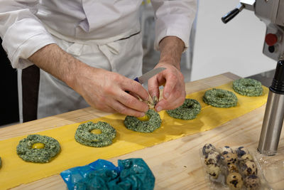 Preparation of ravioli italian pasta with spinach and quail eggs.