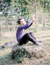 Woman standing on grassy field
