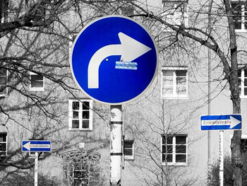 Road sign against blue sky