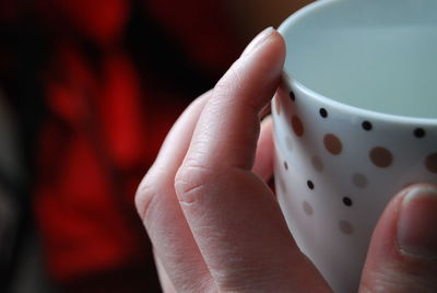 Hand holding mug