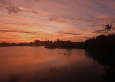 Scenic view of sea against orange sky