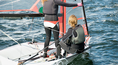 Rear view of woman on boat sailing in sea