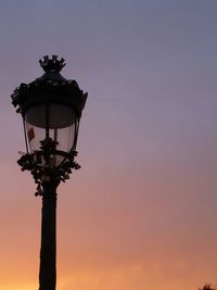 Low angle view of street light against sky