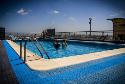 Swimming pool against blue sky