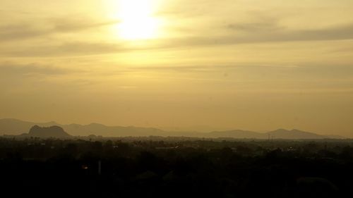 Scenic view of silhouette mountains against sky during sunset