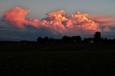 Scenic view of field against sky during sunset