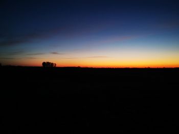 Scenic view of silhouette landscape against sky during sunset