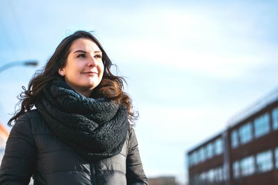 Portrait of young woman looking away in winter