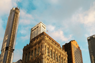 Low angle view of skyscrapers against sky. 