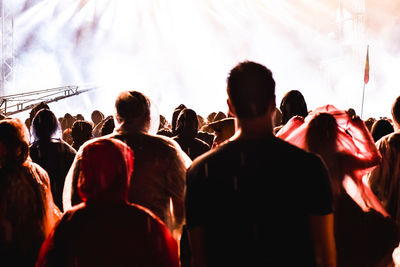 Rear view of people enjoying music concert
