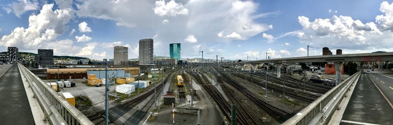 High angle view of railroad tracks in city against sky