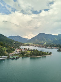 Scenic view of lake and mountains against sky