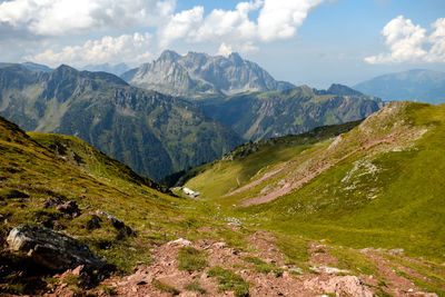 Scenic view of mountains against cloudy sky