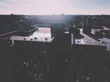 High angle view of buildings in city against sky