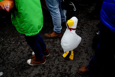Low section of people standing on street