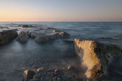 Scenic view of sea against sky during sunset