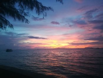 Scenic view of sea against sky at sunset