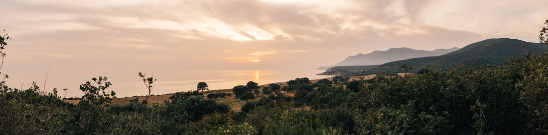 Panoramic view of landscape against sky during sunset