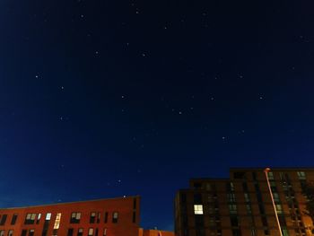 Low angle view of built structure against clear blue sky