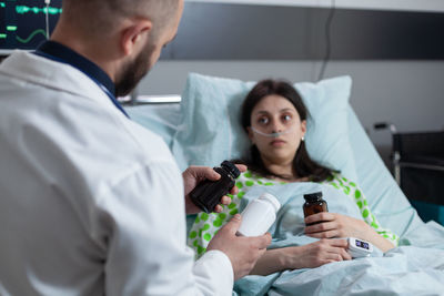 Doctor examining patient in hospital