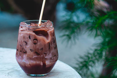 Close-up of iced chocolate drink on table