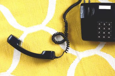 High angle view of telephone on table