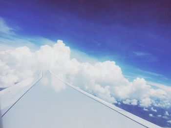 Scenic view of mountains against cloudy sky