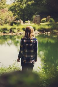 Rear view of a woman relaxing in lake