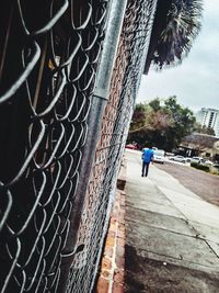 Woman walking on footpath