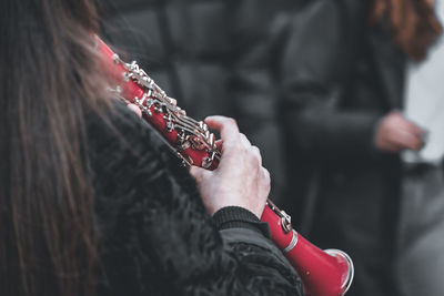 Close-up of hand girl play clarinet 