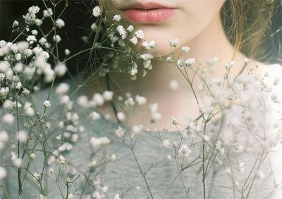 Close-up of woman amidst plants