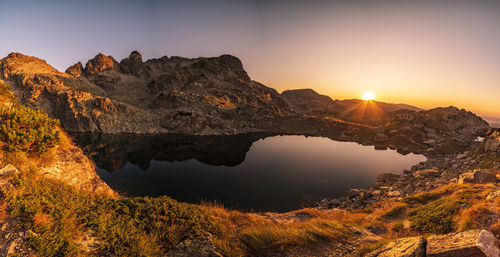 Scenic view of mountains against sky during sunset