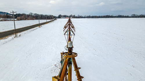 Winter time is a quiet scene on the field with farm equipment left out