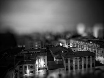 Tilt-shift image of houses in city at night