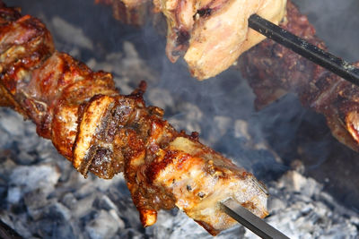 Close-up of meat on barbecue grill