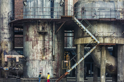 Abandoned factory against old building