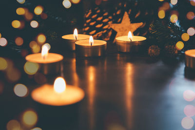 Close-up of illuminated christmas lights on table at night