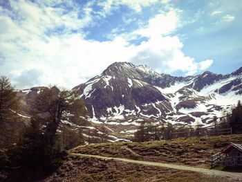 Scenic view of snowcapped mountains against sky